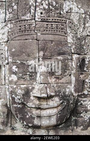 Over 200 enormous Buddha faces are carved into the towers of the Bayon, the most enigmatic building in Angkor Thom, Cambodia. Stock Photo