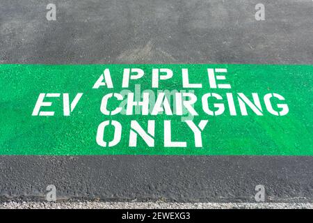 Apple EV Charging Only sign on dedicated parking spot for electrical vehicles near charging station - Cupertino, California, USA - 2021 Stock Photo