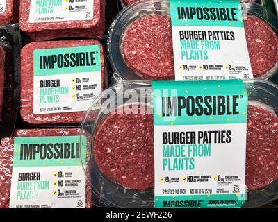 Impossible Foods brand made from plants Impossible Burgers patties in refrigerator section of the meat department of grocery store - San Jose, Califor Stock Photo