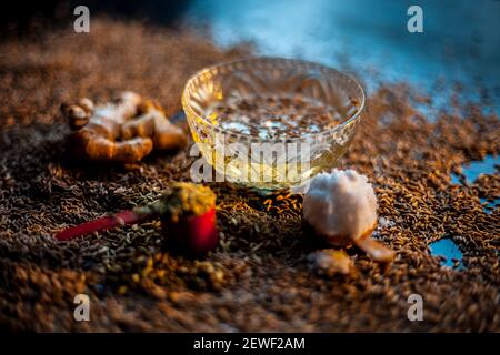 Shot of cumin seeds, sea salt, ginger powder,fennel seeds on brown surface for curing bloating. Stock Photo