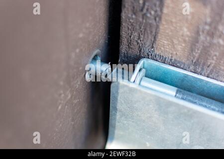 Slide bolt door latch cut with bolt cutter. Selective focus. Close up. Stock Photo