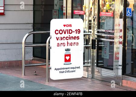 Covid-19 vaccines are here sign advertises coronavirus vaccination location at CVS Pharmacy store. - Palo Alto, California, USA - February, 2021 Stock Photo