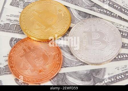 Dollar and bitcoins as symbol of electronic virtual money, choice between traditional paper money and cryptocurrency Stock Photo