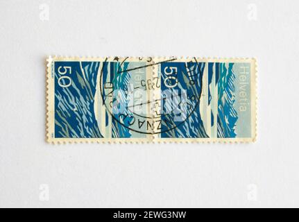 03.03.2021 İstanbul Turkey. Postage Stamp. Helvetia SWITZERLAND-CIRCA 1991: A stamp printed in Switzerland, shows a mountain lake (Lago Moesola), Stock Photo