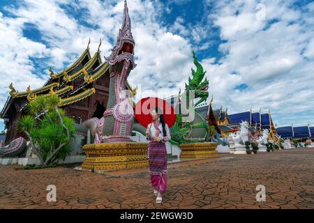 Asian women wearing Thai dress costume traditional according Thai culture at temple in Chiang Mai. Stock Photo