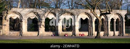 YORK, NORTH YORKSHIRE, UK - MARCH 14, 2010: Panorama view of stone arches in Deans Park which hold a war memorial plaque to the 2nd British Division Stock Photo