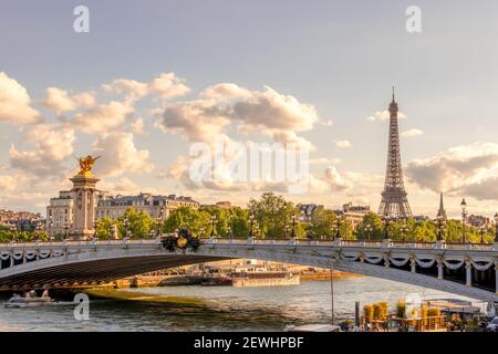 France. Sunny summer day in Paris. Alexander III Bridge and Eiffel Tower.