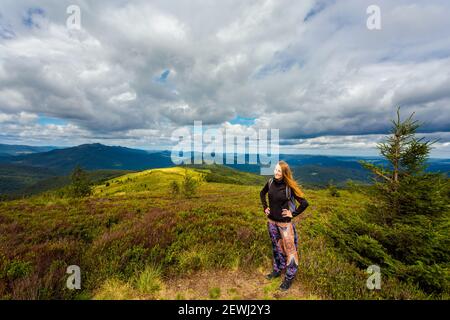 Beautiful young woman in polish Bieszczady mountains during summer. Trail via Bukowe Berdo to Tarnica, Bieszczadzki Park Narodowy Stock Photo