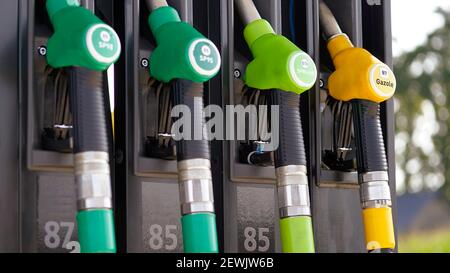 Fuel crane gaz equipment filling guns at the gas station Stock Photo