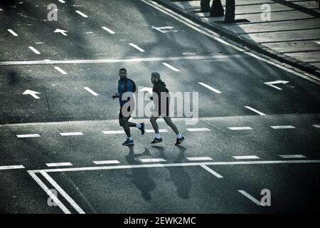 Two young man doing sport in a street. Stock Photo
