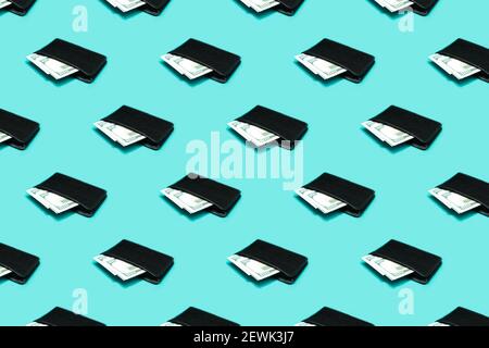 Seamless pattern of black leather wallet with dollar bills on blue background. Men's purse with money bills  Stock Photo
