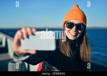The girl is making a selfie on the street Stock Photo