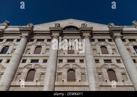 Milan. Maurizio Cattelan middle finger piazza affariMidnight Palace, seat of the Italian stock exchange Stock Photo