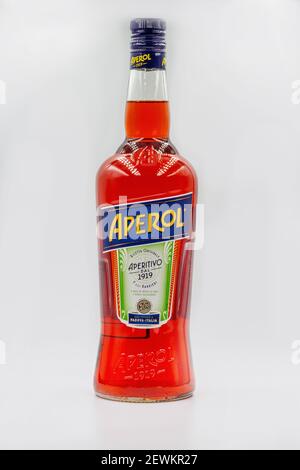 KYIV, UKRAINE - DECEMBER 16, 2020: Studio shoot of Aperol Aperitivo Liqueur bottle closeup against white. Famous Italian aperitif produced by DCM Spa, Stock Photo