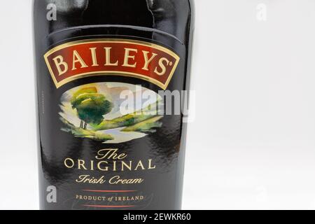 KYIV, UKRAINE - DECEMBER 16, 2020: Studio shoot of bottle label of Baileys Irish cream alcoholic beverage made by Diageo company closeup on white back Stock Photo