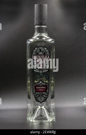 KYIV, UKRAINE - DECEMBER 16, 2020: Kozakska Rada vodka bottle closeup against black. It is an authentic Ukrainian product made according to the origin Stock Photo