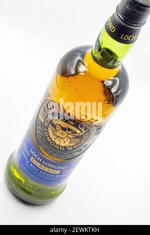 KYIV, UKRAINE - DECEMBER 17, 2020: Studio shoot of Loch Lomond Classic Single Malt Scotch whisky bottle closeup against white. Stock Photo