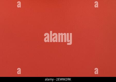 Red paper background. Persian red colour paper texture. Matte monochrome surface. Stock Photo