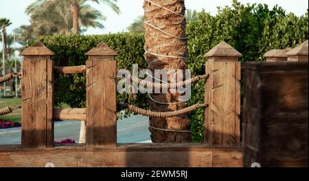 Large wooden handrails in a tropical setting. Stock Photo