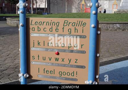 A close up view of the Learning Braille board in the St. Michan' Park in Dublin city center. Stock Photo