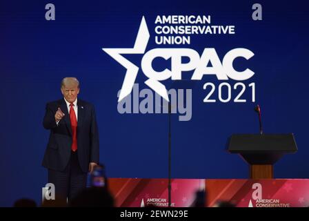 Orlando, Florida, USA. 28th Feb, 2021. Former President Donald Trump gestures to attendees before speaking at the 2021 Conservative Political Action Conference (CPAC) at the Hyatt Regency. The four day gathering of conservatives, usually held in the Washington, DC area, was relocated to Florida this year where Gov. Ron DeSantis has imposed fewer COVID-19 restrictions. Credit: Paul Hennessy/SOPA Images/ZUMA Wire/Alamy Live News Stock Photo