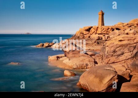 Lighthouse of Ploumanach at the golden hour in Perros-Guirec, Côtes d'Armor, Brittany, France Stock Photo