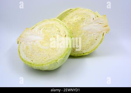 Considering green cabbage cradled inlet located on a white background.