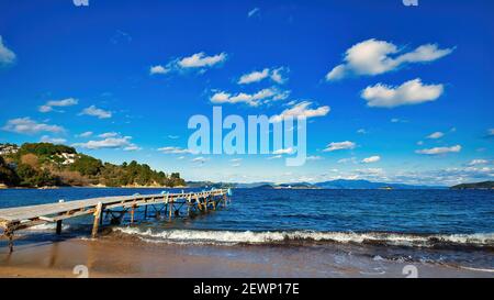 beach with wooden pier, Tzaneria beach, Skiathos island .Greece, world famous beautiful beach. Stock Photo