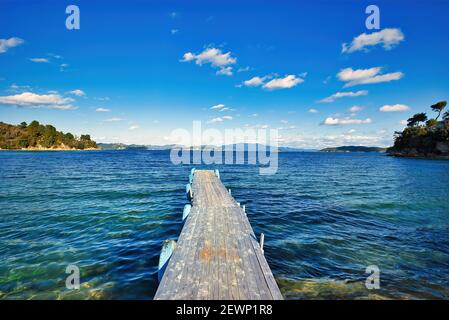 beach with wooden pier, Tzaneria beach, Skiathos island .Greece, world famous beautiful beach. Stock Photo