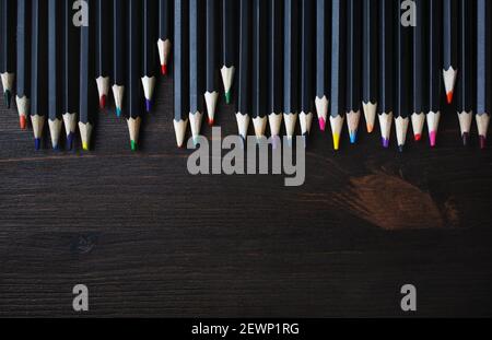 Color pencils on wood table background. Color pencils for drawing. Flat lay. Stock Photo