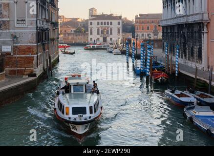 VENICE, Italy - December 12, 2015: Motorboat among the canals of Venice in a winter afternoon Stock Photo