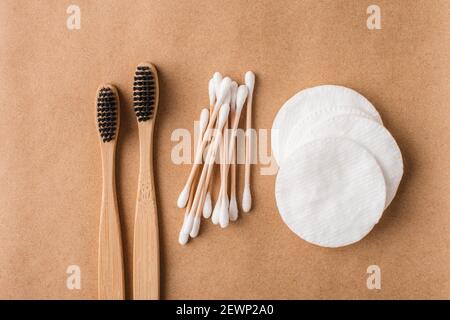 Eco friendly cosmetology and medical cleansing accessories such as cotton pads, charcoal toothbrushes and bamboo ear sticks. Recycle, reusable, plasti Stock Photo