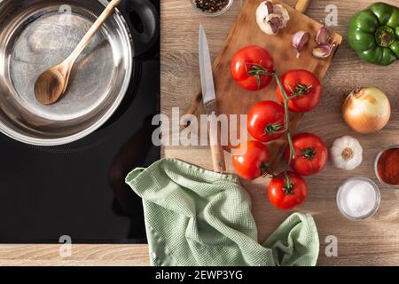 Ingredients to make tomato sauce on the kitchen counter Stock Photo