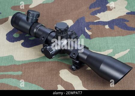 camouflaged sniper rifle with optic sight Stock Photo - Alamy