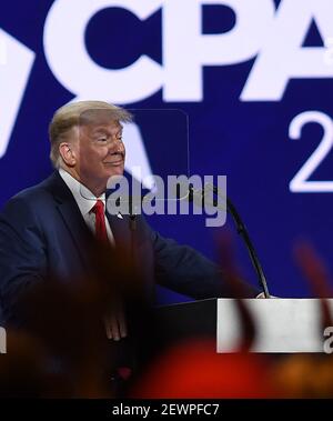 Orlando, United States. 28th Feb, 2021. Former President Donald Trump, seen through a teleprompter screen while addressing attendees at the 2021 Conservative Political Action Conference (CPAC) at the Hyatt Regency. The four day gathering of conservatives, usually held in the Washington, DC area, was relocated to Florida this year where Gov. Ron DeSantis has imposed fewer COVID-19 restrictions. Credit: SOPA Images Limited/Alamy Live News Stock Photo
