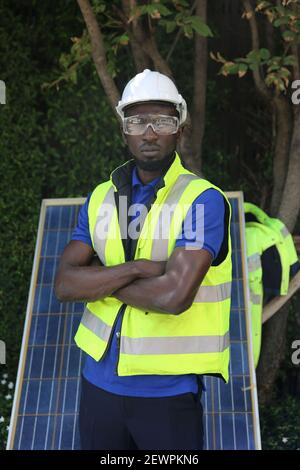 maintenance engineer, Solar energy systems engineer perform analysis solar panels, Portrait of engineer man or worker, people, with solar panels or so Stock Photo