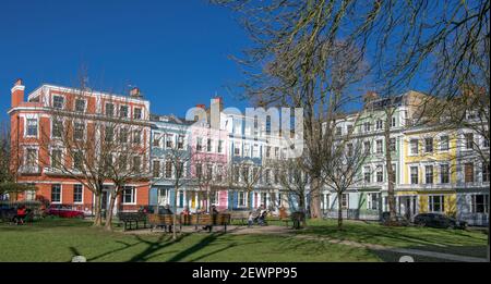 Brightly coloured Italianate terraced houses grade ll listed Chalcot Square Primrose Hill north London England Stock Photo