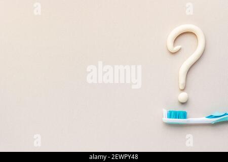 Question Mark With Toothpaste Question mark of toothpaste with toothbrush, top view. Oral care and ...