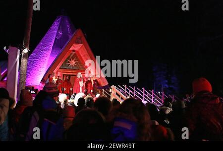 Tourists on a reindeer ride at the Santa Claus Village, in Rovaniemi,  Finland. Rovaniemi is the provincial capital of Finnish Lapland and is  situated on the Arctic Circle, it is also the