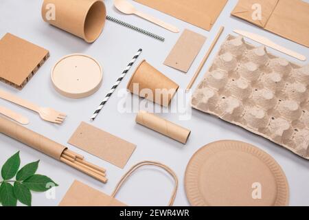 Flat lay composition with disposable tableware and monstera leaves on ...