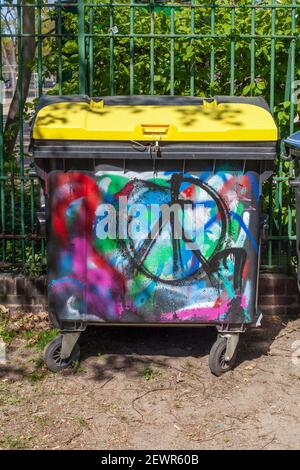 Colorful Painted Yellow Garbage Can, Recycling Garbage Can For Plastic Waste, Germany, Europe Stock Photo