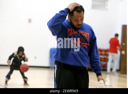 https://l450v.alamy.com/450v/2ewr969/having-been-going-since-early-in-the-morning-single-father-kendrick-bates-29-has-run-low-on-energy-while-volunteering-as-a-special-olympics-basketball-coach-in-the-evening-on-jan-21-2016-in-new-ulm-minn-with-few-exceptions-anywhere-bates-goes-goes-his-daughter-charisse-6-rear-left-photo-by-david-jolesminneapolis-star-tribunetns-please-use-credit-from-credit-field-2ewr969.jpg