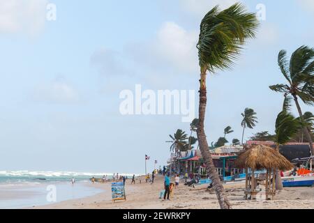 Punta Cana, Dominican republic - January 14, 2020: Tourists are on the beach of Punta Cana resort near small souvenir shops and restaurants Stock Photo