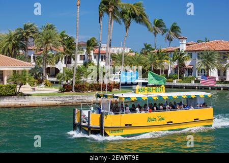 Colourful water taxi cruising along the New River, Las Olas Isles, Fort Lauderdale, Florida, United States of America, North America Stock Photo