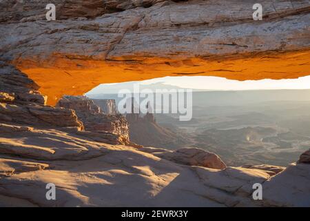 Close up view of canyon through Mesa Arch with glowing arch, Canyonlands National Park, Utah, United States of America, North America