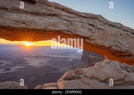 Close up view of canyon through Mesa Arch at sunrise, Canyonlands National Park, Utah, United States of America, North America Stock Photo