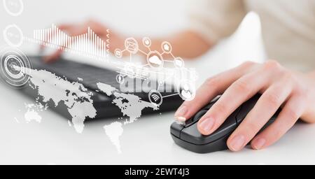 Financial data processing and world map over woman using computer Stock Photo