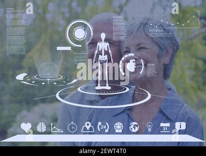 Scientific data processing with human skeleton and scope scanning over happy senior couple Stock Photo