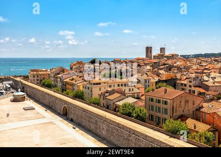 View from above on old town of Antibes under blue sky as Mediterranean sea on background on French Riviera. Stock Photo