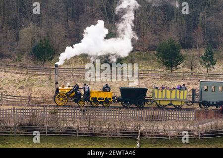 Replica of Stephenson's Rocket steam locomotive pulling train at Beamish Museum north east England UK Stock Photo